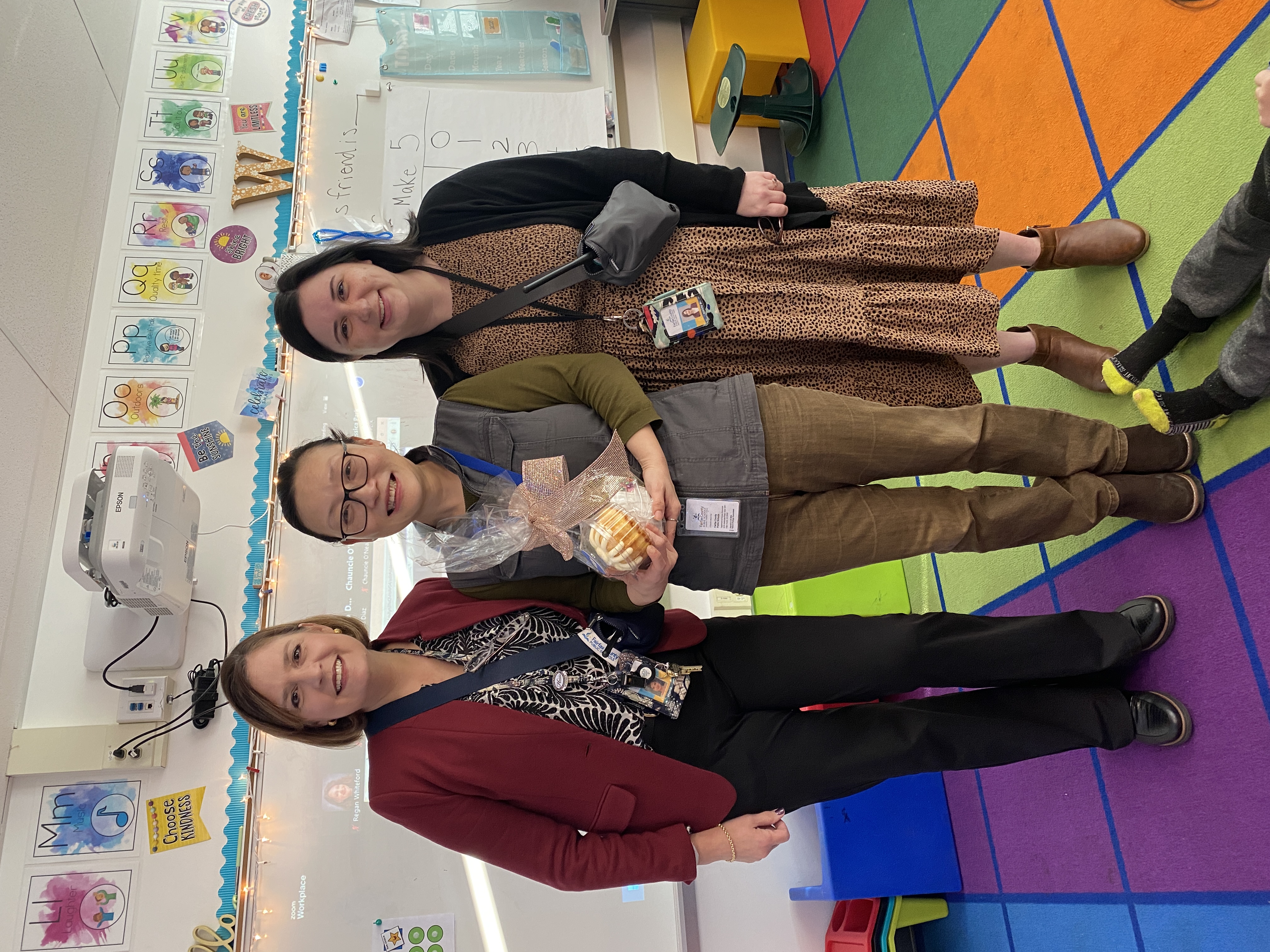 Ourstanding Operational Employee, Cindy Rogers, accepts award from Ingrid Badia and Nicole Scher.