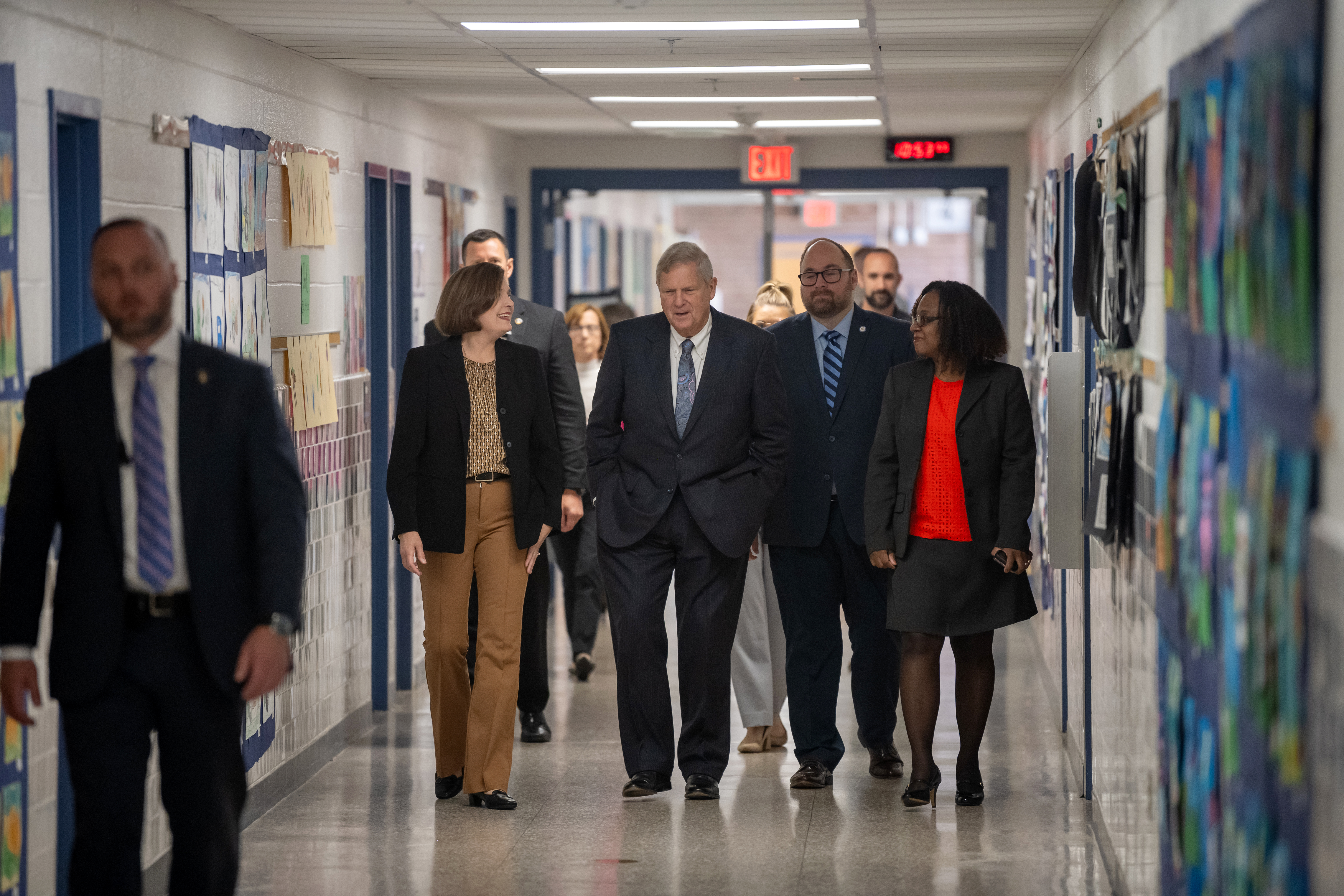 USDA Secretary Vilsack meets Fairfax County School Board Vice-Chair Karl Frisch and Mason District Representative Ricardy Anderson during a tour led by Annandale Terrace ES Principal Ingrid Badia.