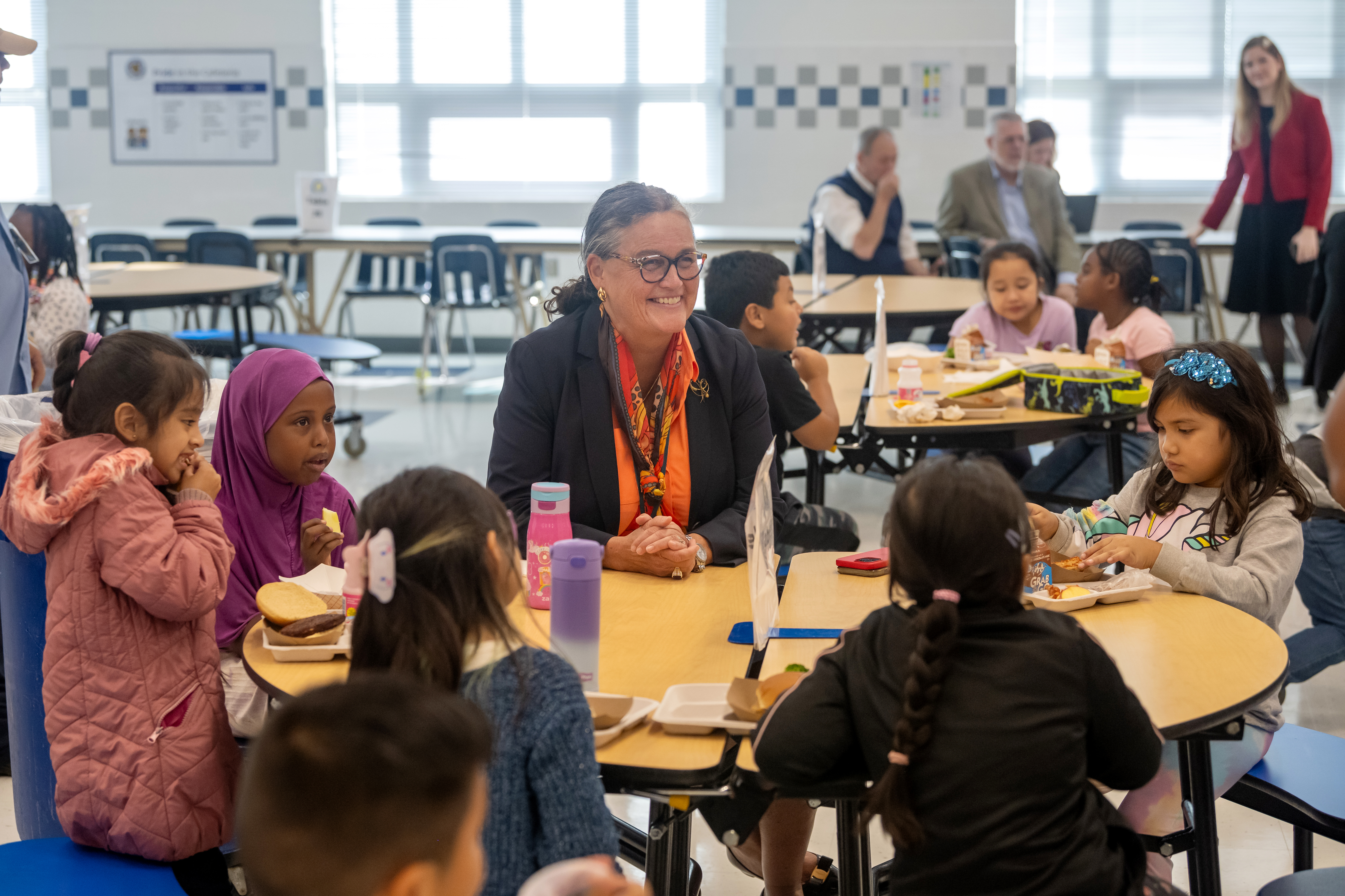Superintendent Dr. Michelle Reid joins an Annandale Terrace Elementary School student at the cafeteria table.